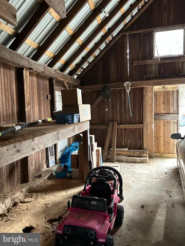 a backyard of a house with a table and chairs