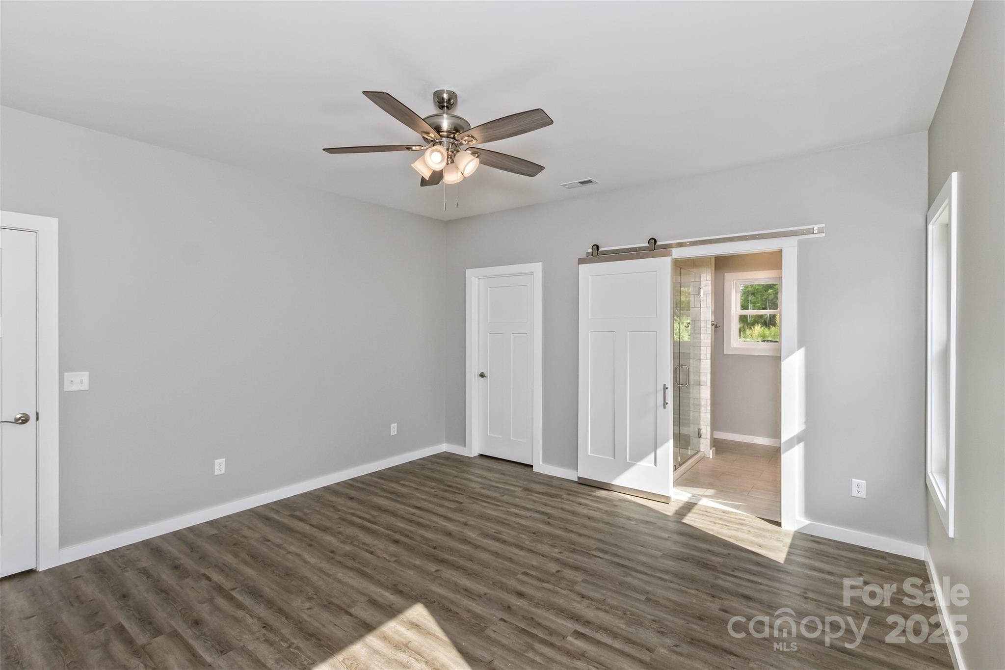 144 Peyton Elaine Road Clyde, NC 28721 - Photo 17 of 41 a view of empty room with wooden floor