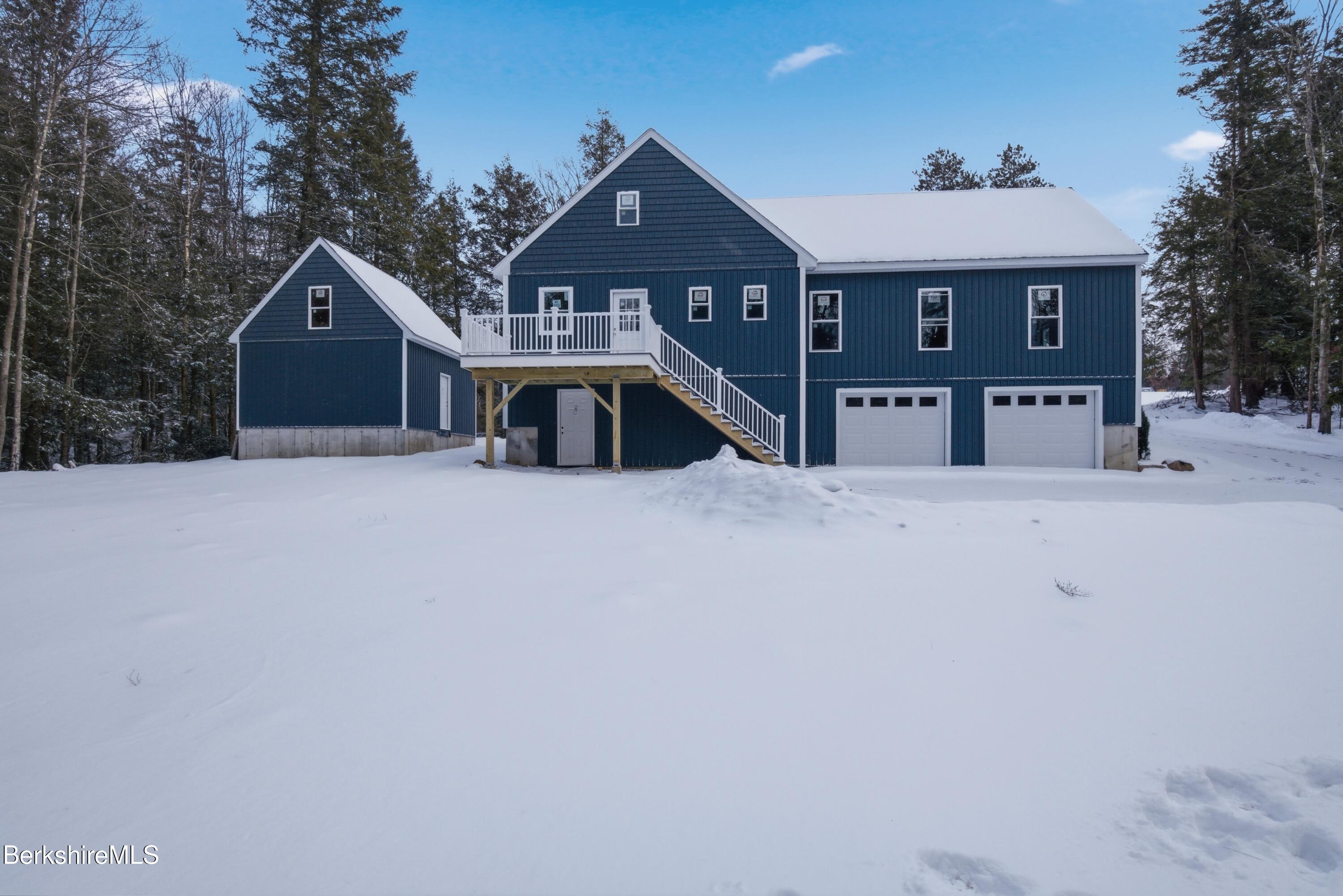 13 Haskell Road Peru, MA 01235 - Photo 23 of 28 a front view of a house with large trees