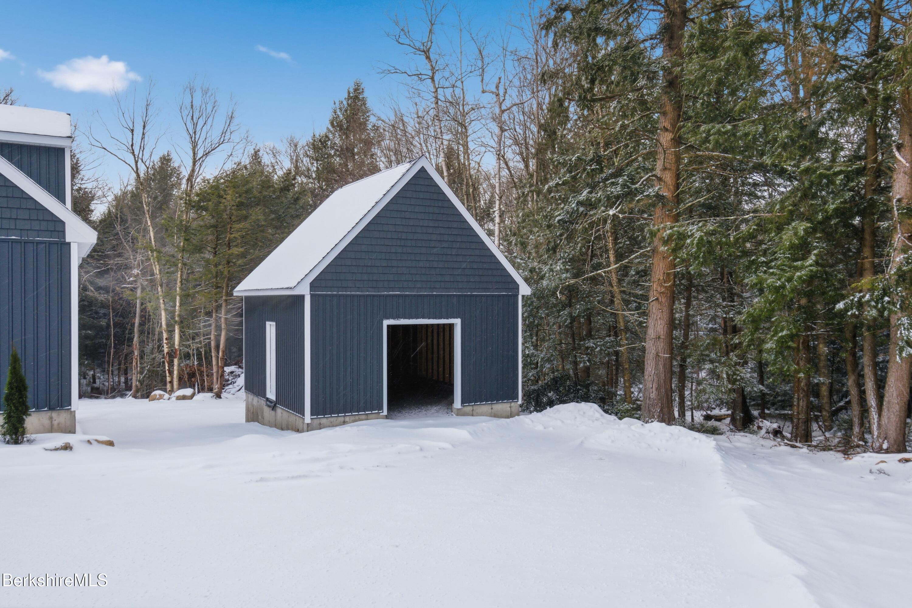 13 Haskell Road Peru, MA 01235 - Photo 26 of 28 a view of a house with a yard and garage