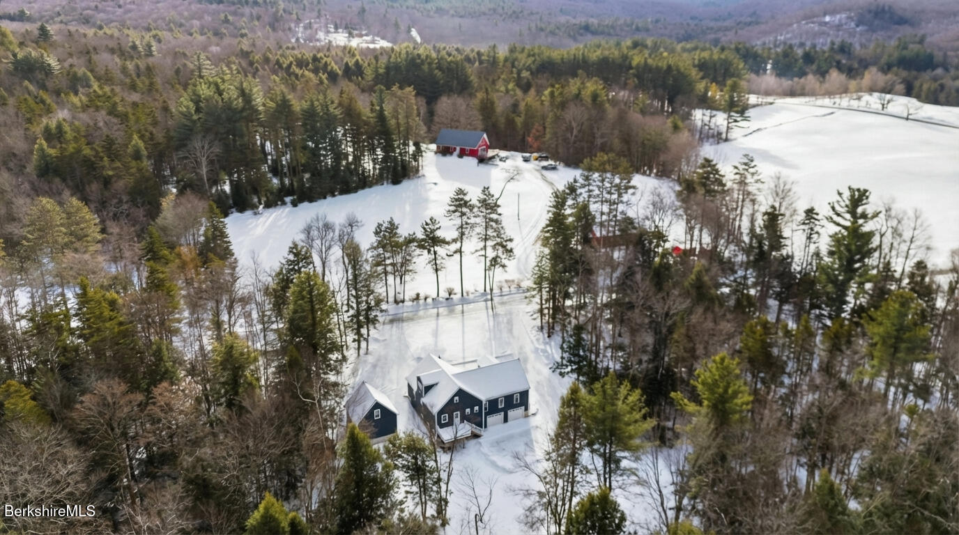 13 Haskell Road Peru, MA 01235 - Photo 3 of 28 a view of a lake in between two of trees