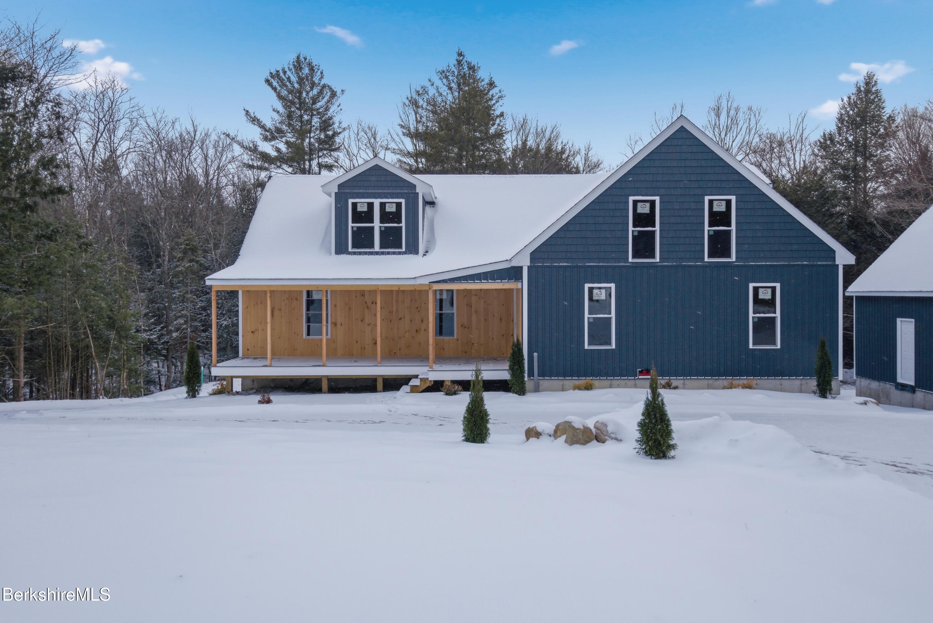 13 Haskell Road Peru, MA 01235 - Photo 7 of 28 a front view of a house with a yard