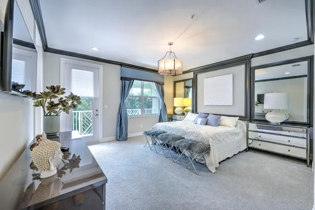 a spacious bedroom with a bed and window