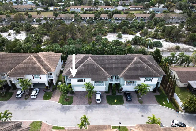 an aerial view of a house with a garden