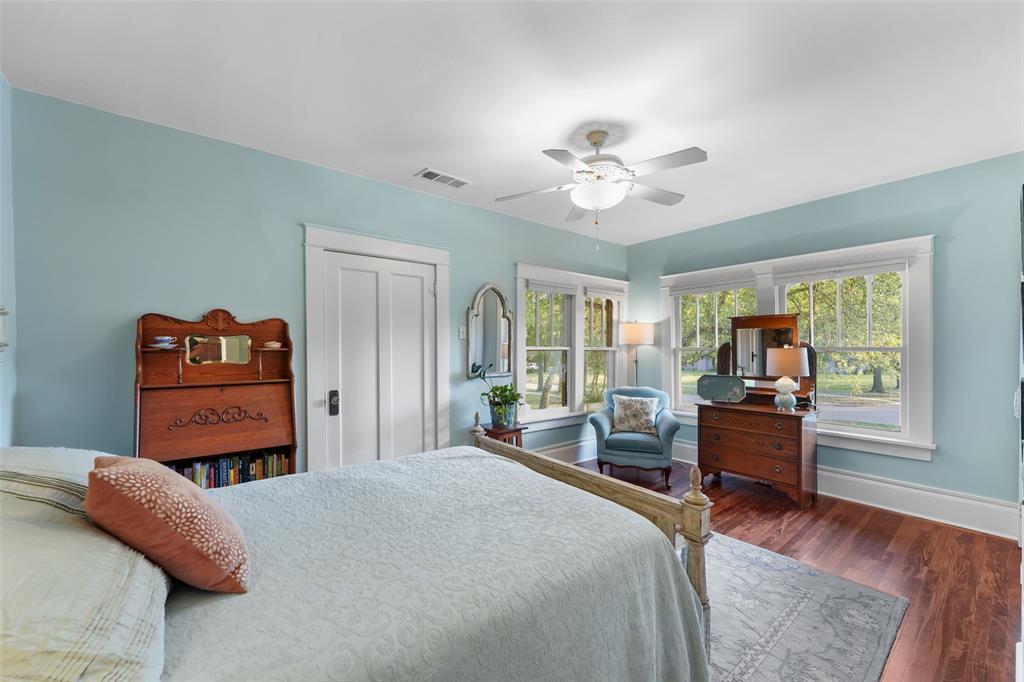 406 Griffith Avenue Terrell, TX 75160 - Photo 30 of 40 This room features light blue walls, a ceiling fan with integrated lighting, and multiple windows providing natural light