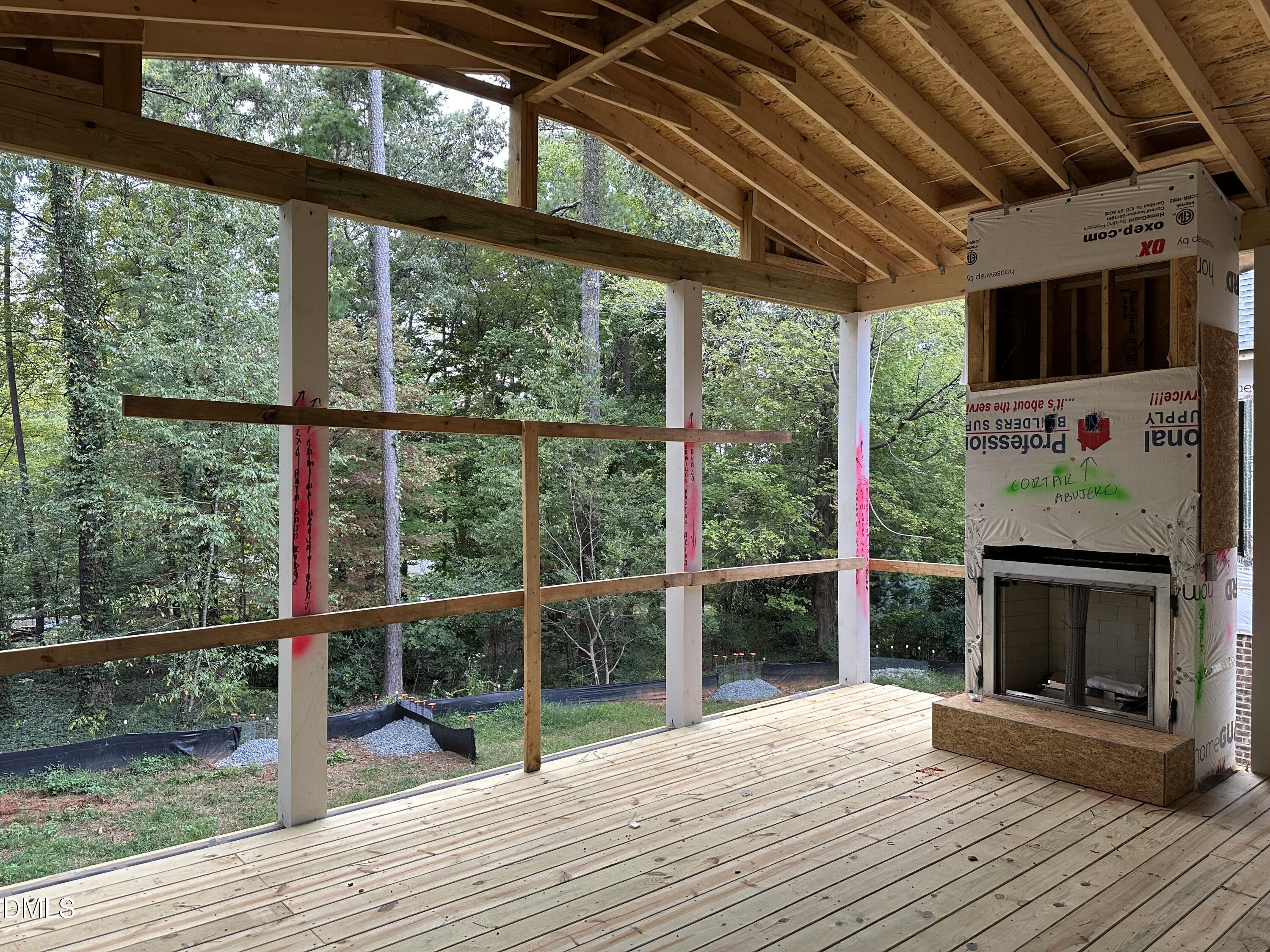 1609 Ridge Road Raleigh, NC 27607 - Photo 5 of 20 a view of livingroom with wooden floor and fireplace