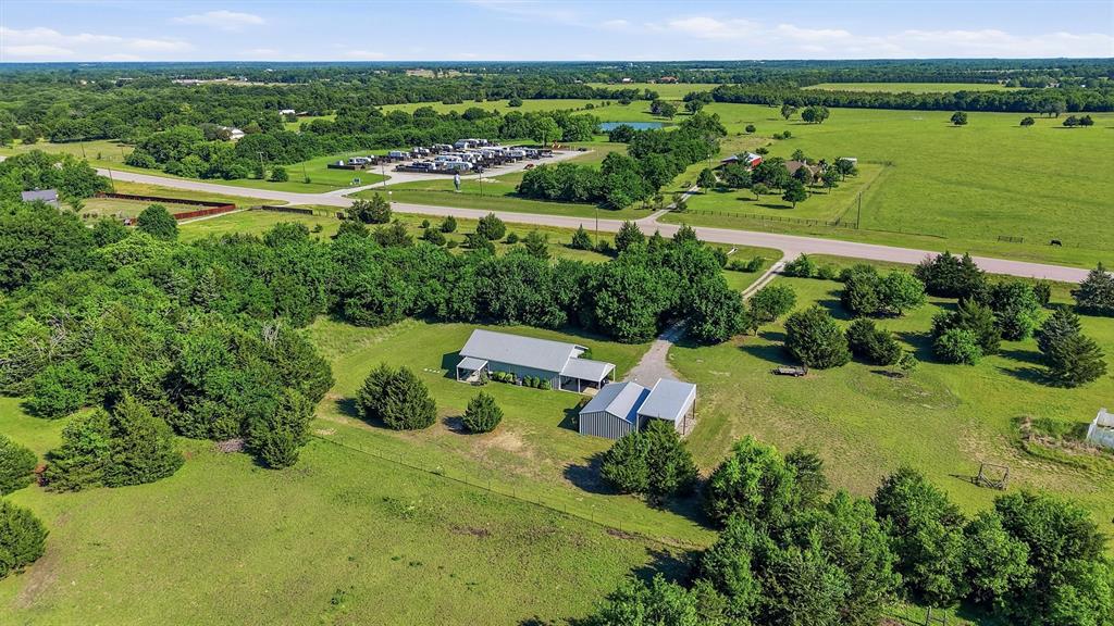 15656 South State Highway 78 Blue Ridge, TX 75424 - Photo 3 of 36 an aerial view of a house with a garden and lake view