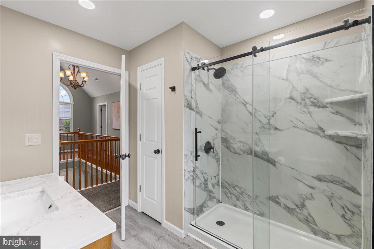 51 Egbert Street Pemberton, NJ 08068 - Photo 12 of 36 a bathroom with a shower and a sink