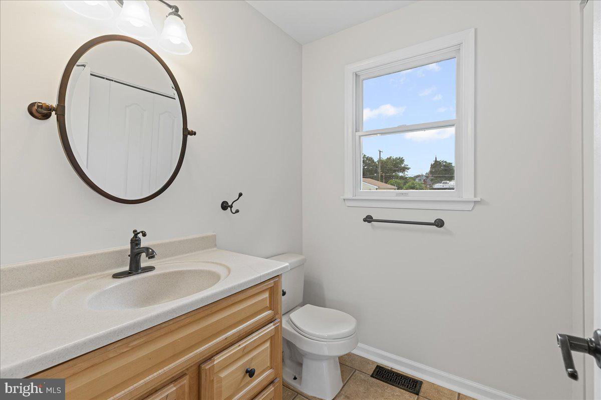 51 Egbert Street Pemberton, NJ 08068 - Photo 19 of 36 a bathroom with a sink a mirror and a toilet
