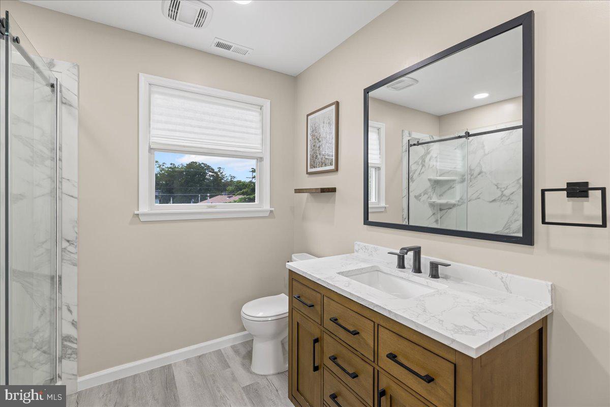 51 Egbert Street Pemberton, NJ 08068 - Photo 29 of 36 a bathroom with a sink vanity and a toilet