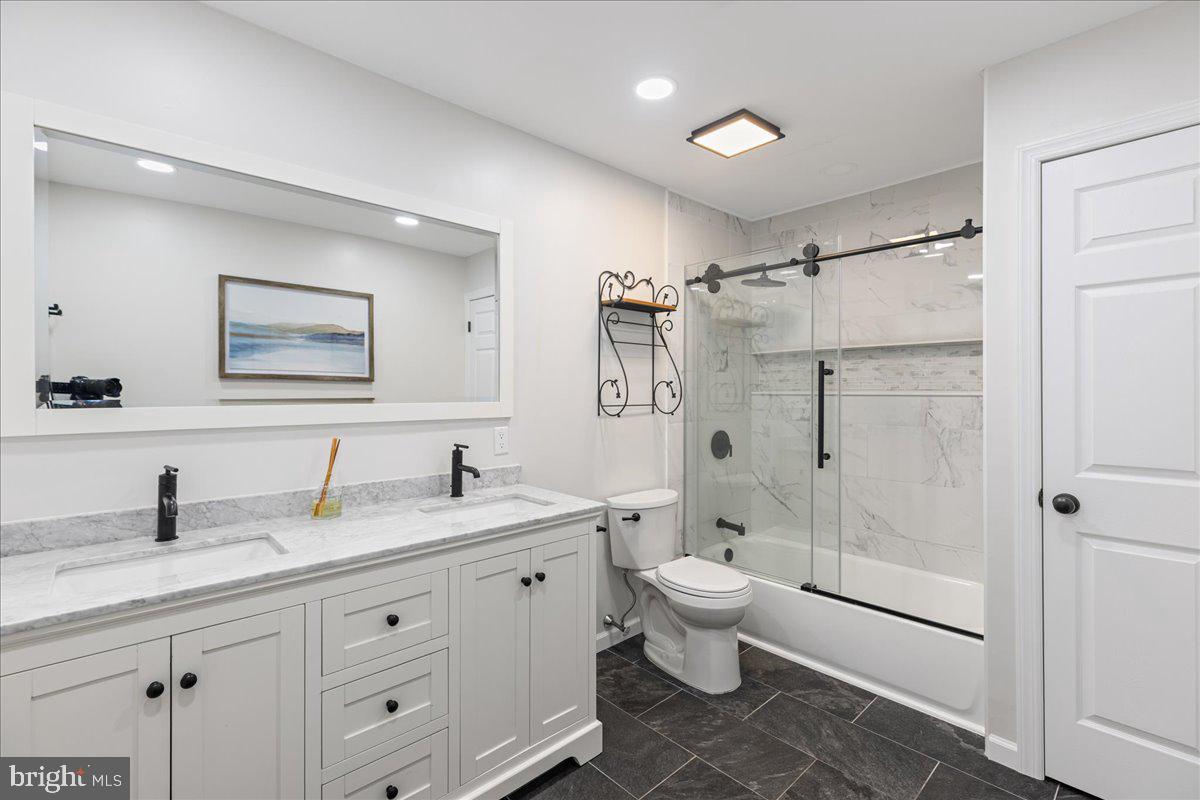 51 Egbert Street Pemberton, NJ 08068 - Photo 3 of 36 a bathroom with a double vanity sink toilet mirror and shower