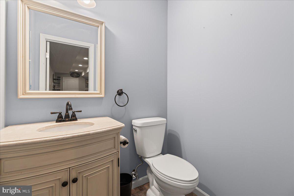 51 Egbert Street Pemberton, NJ 08068 - Photo 33 of 36 a bathroom with a toilet a sink and mirror