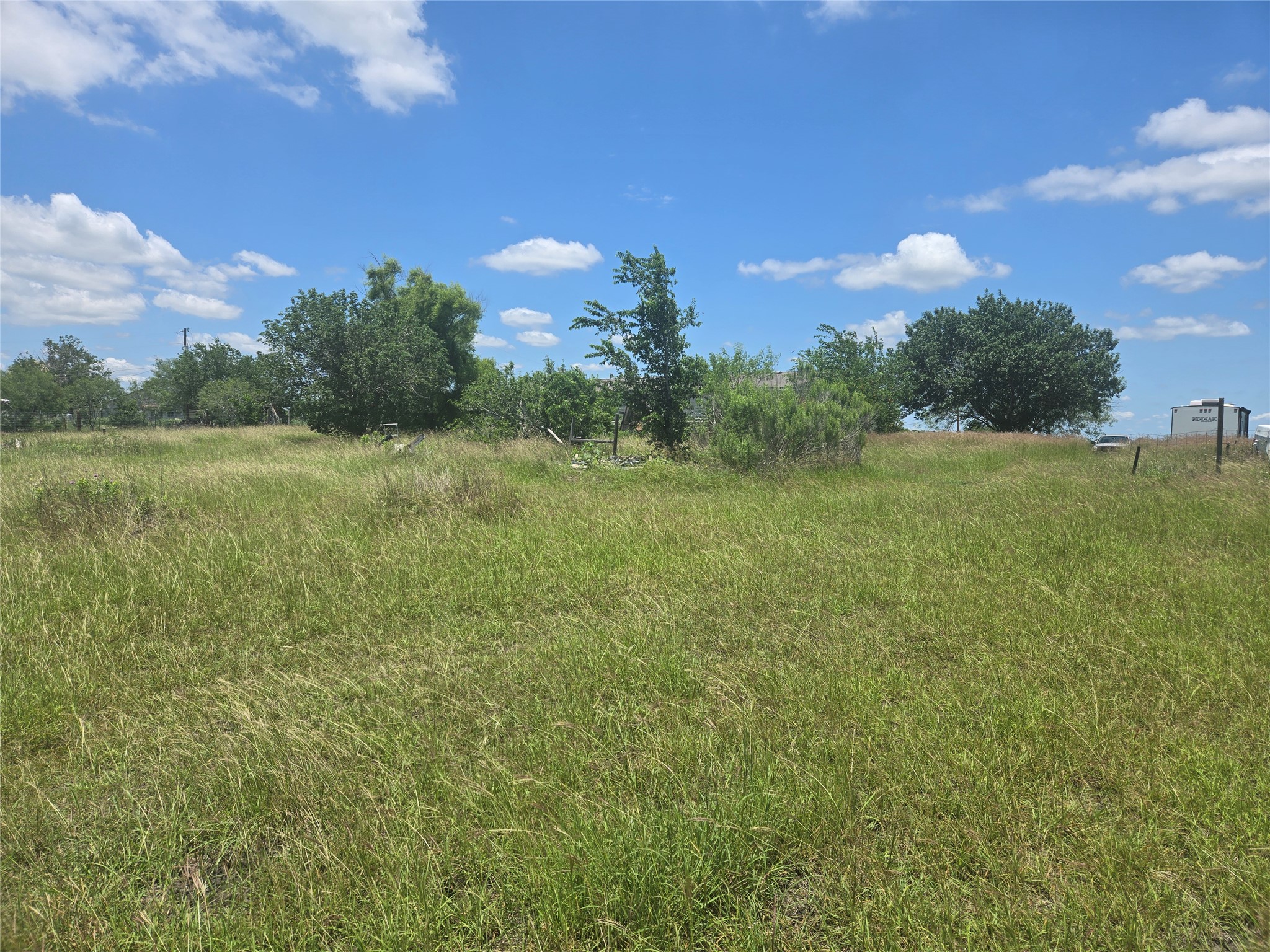 150 Longhorn Loop Kyle, TX 78640 - Photo 6 of 13 a view of a field with an trees