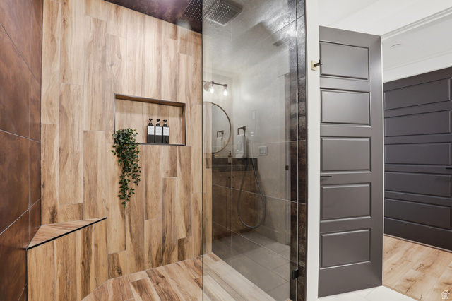 1000 West Upper Cove Road Park City, UT 84098 - Photo 32 of 63 Walk-in shower with wood-look tile surround and an integrated niche