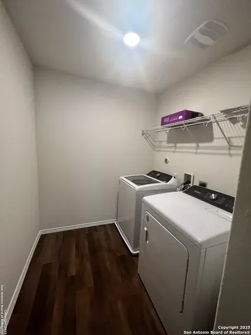 a utility room with dryer and washer
