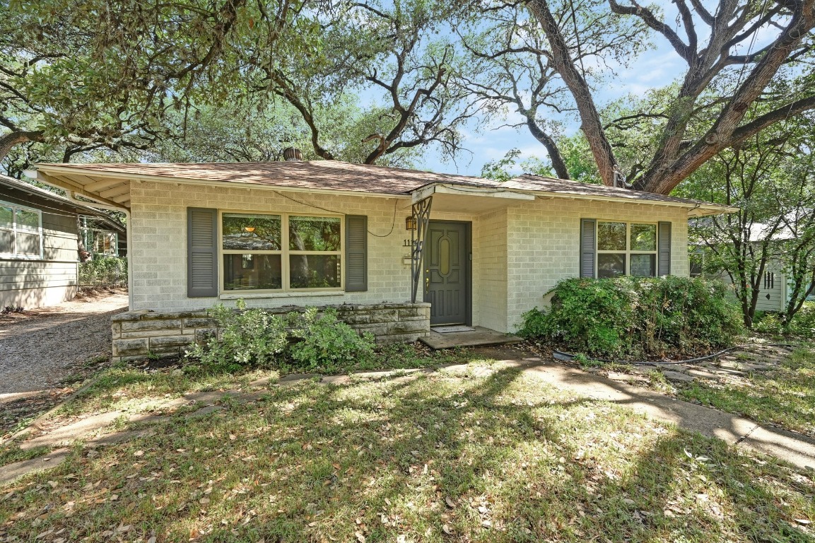 front view of a house with a yard
