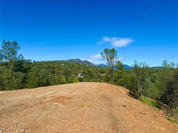 a view of a road with a yard