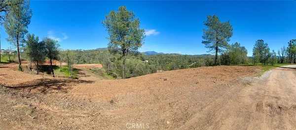 a view of a backyard of a house