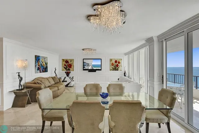a kitchen with granite countertop a sink a counter top space appliances and cabinets