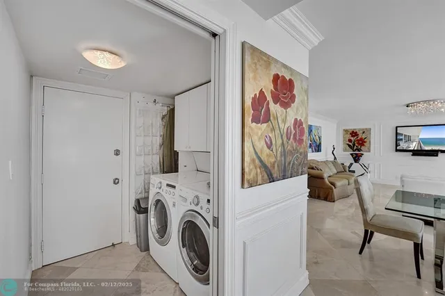 a kitchen with stainless steel appliances granite countertop a sink a stove and refrigerator