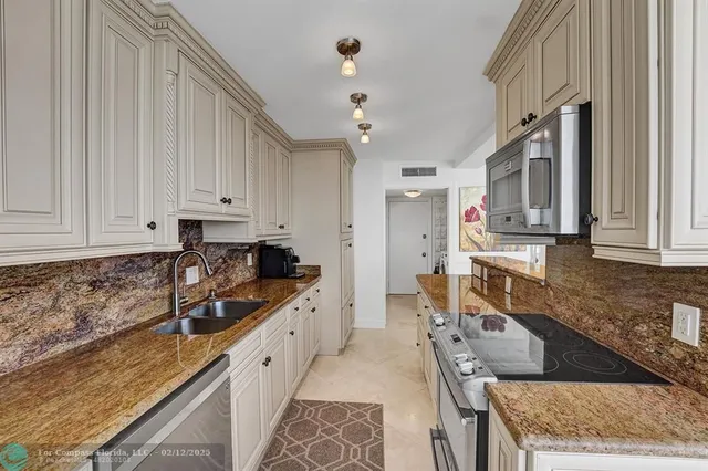 a bedroom with a bed next to a large window