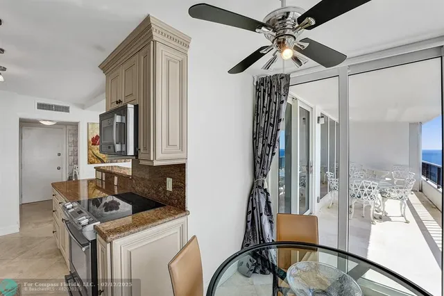 a view of a hallway with paintings on the wall
