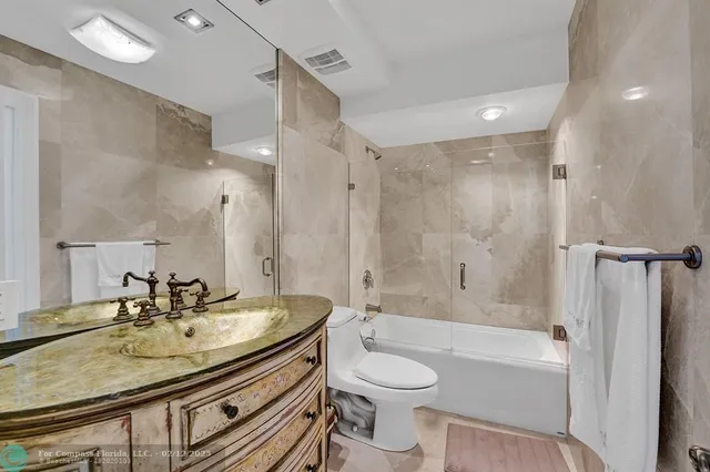 a kitchen with stainless steel appliances granite countertop a sink and a cabinets