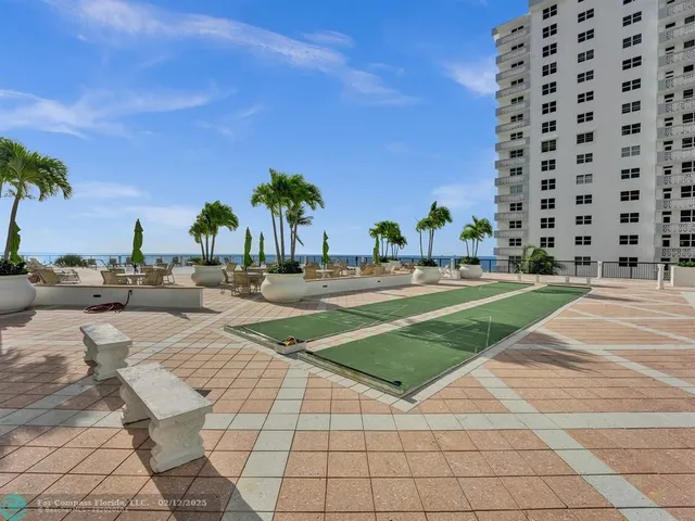 a view of an chairs and tables in patio