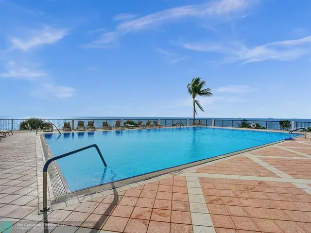 a view of a chairs and table in patio
