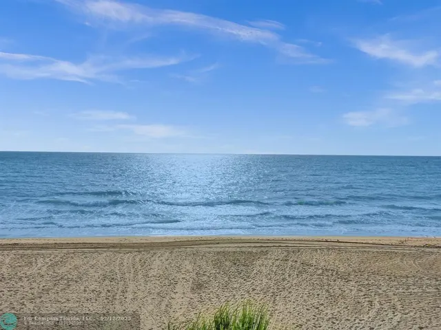 a view of a terrace with a table and chairs