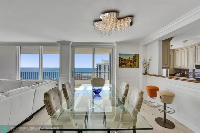a kitchen with granite countertop a sink a counter top space appliances and cabinets