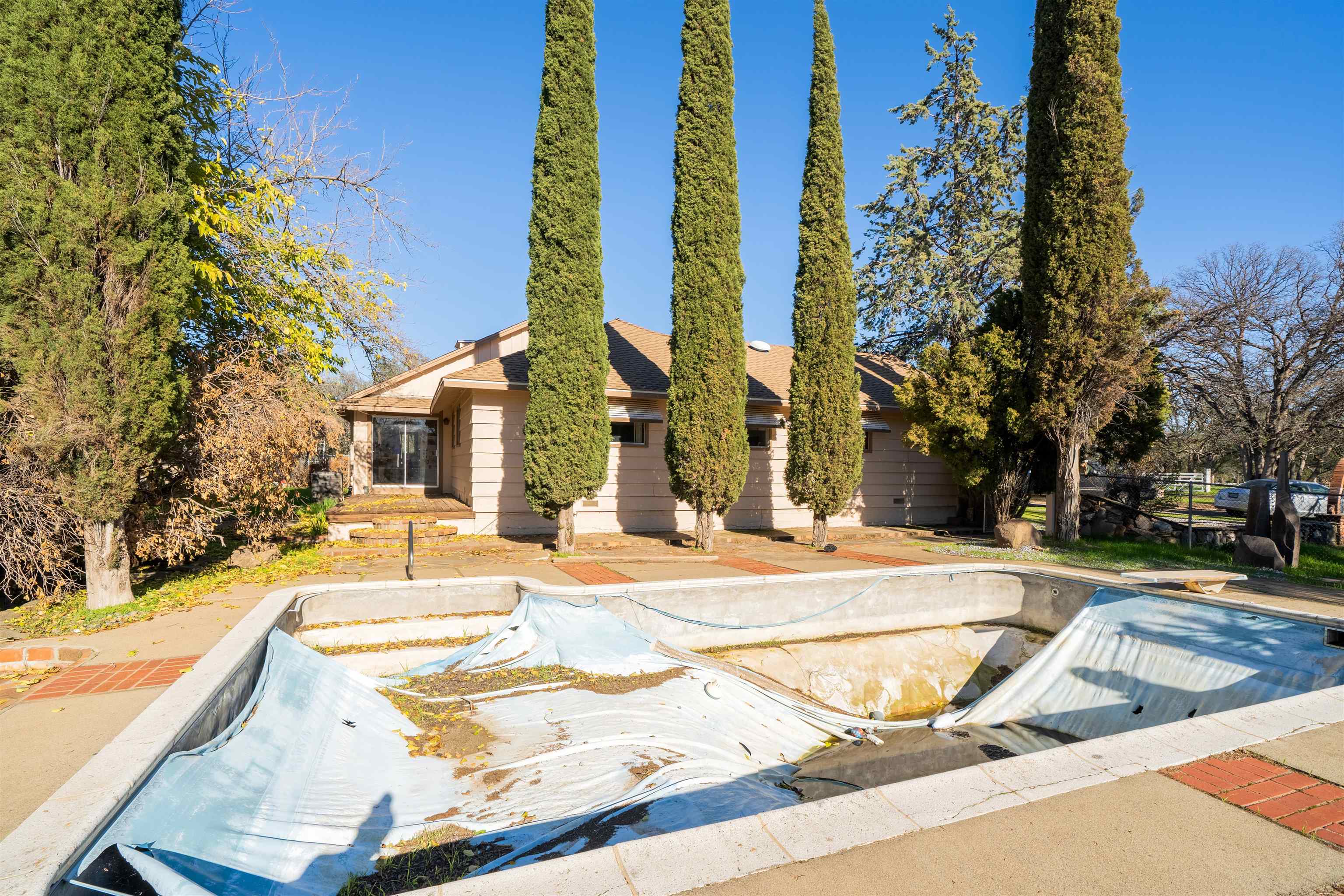 19050 Ridge Road Red Bluff, CA 96080 - Photo 19 of 36 a view of a swimming pool with a lounge chairs