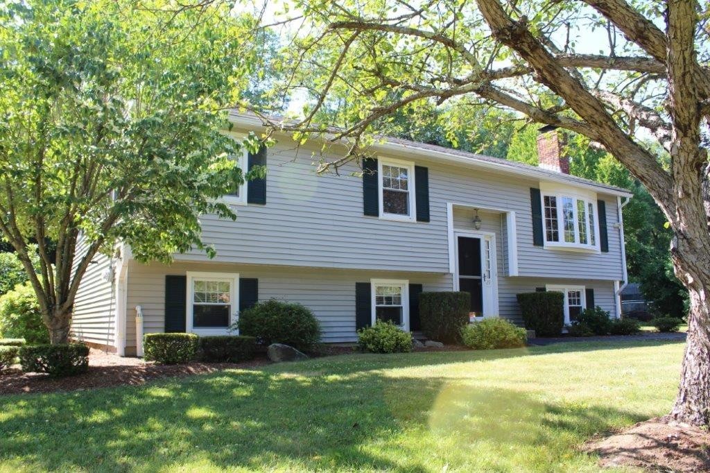 229 North Brookfield Road Barre, MA 01005 - Photo 2 of 30 a front view of a house with a yard and garage