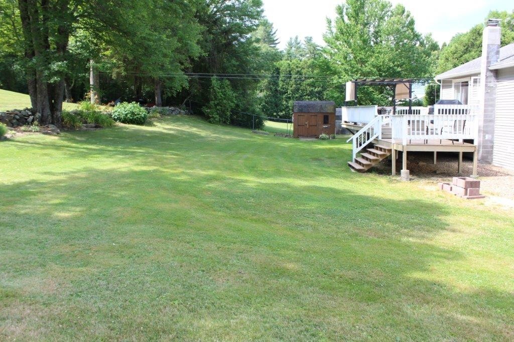 229 North Brookfield Road Barre, MA 01005 - Photo 29 of 30 a view of a house with a backyard porch and sitting area