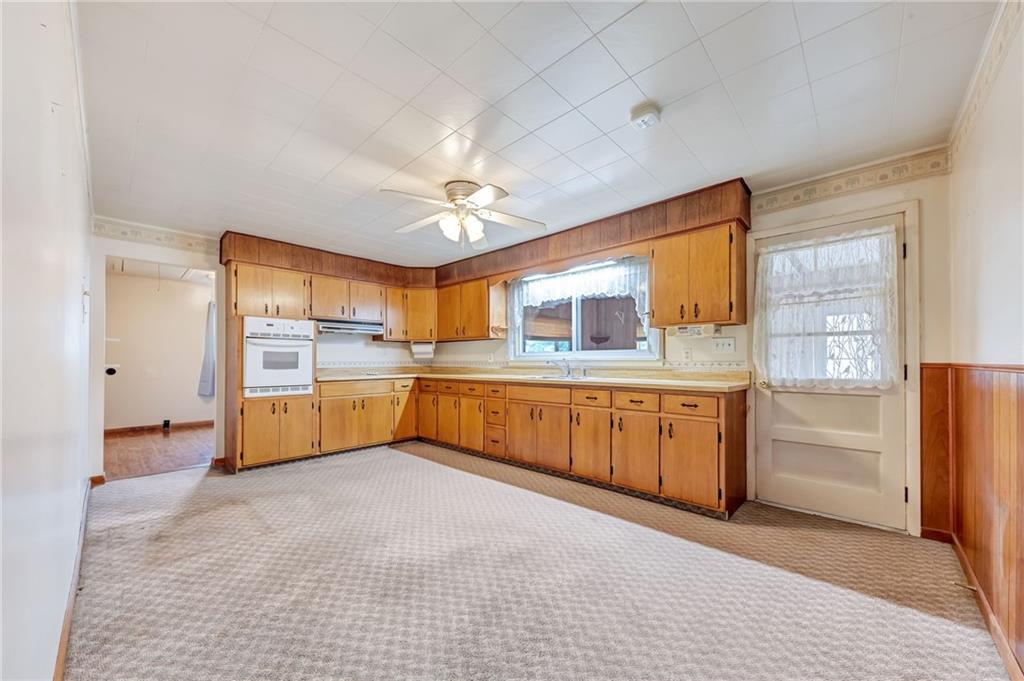 116 Eckles Drive Industry, PA 15052 - Photo 12 of 30 a large kitchen with stainless steel appliances granite countertop a refrigerator and a stove top oven
