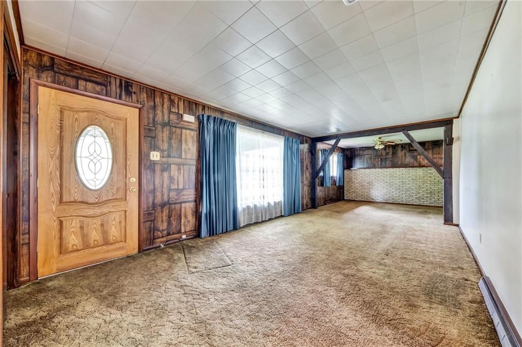 116 Eckles Drive Industry, PA 15052 - Photo 13 of 30 a view of an empty room with wooden floor and window