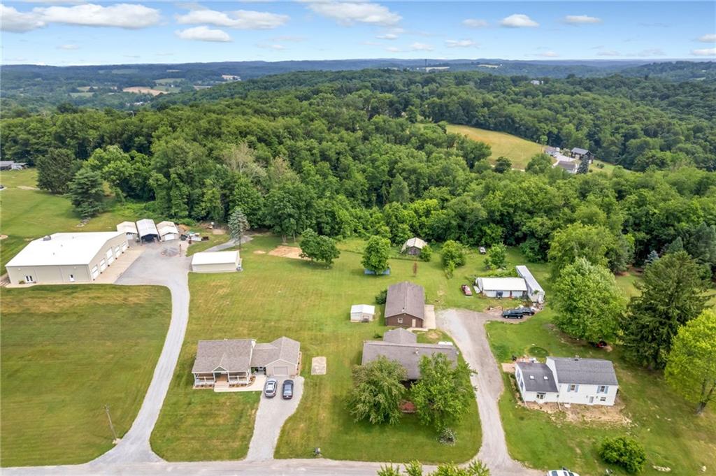 116 Eckles Drive Industry, PA 15052 - Photo 3 of 30 an aerial view of a house with a garden and lake view