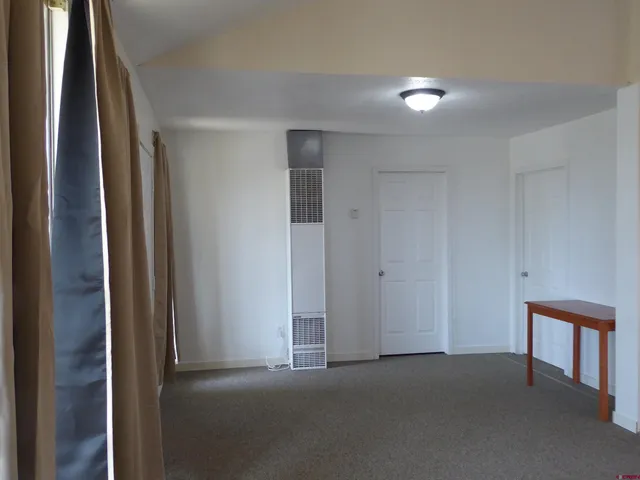 a view of a wooden house with a outdoor space