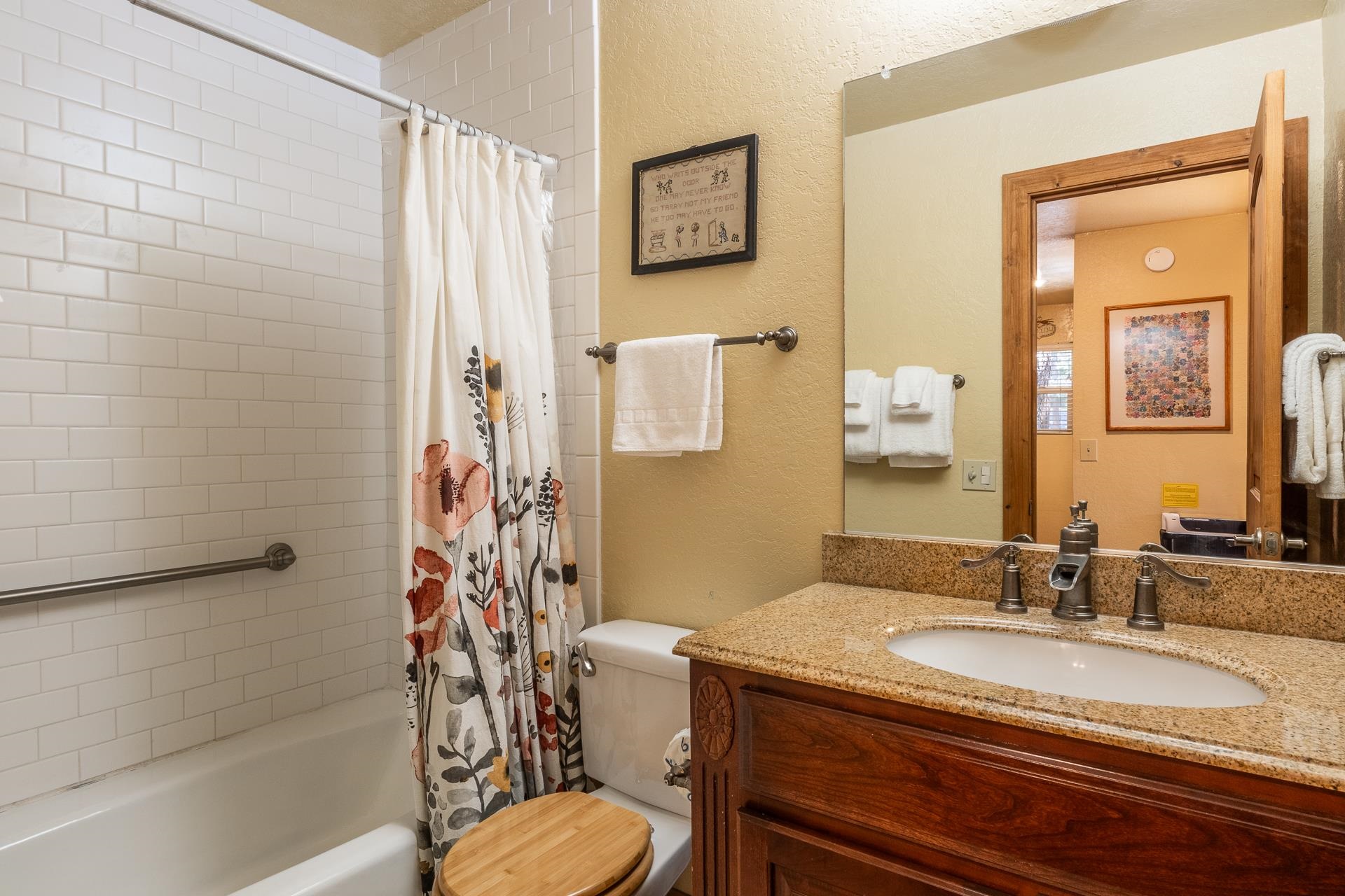 153 Lake Mary Road, Unit 29 Mammoth Lakes, CA 93546 - Photo 20 of 44 a bathroom with a granite countertop sink toilet and shower