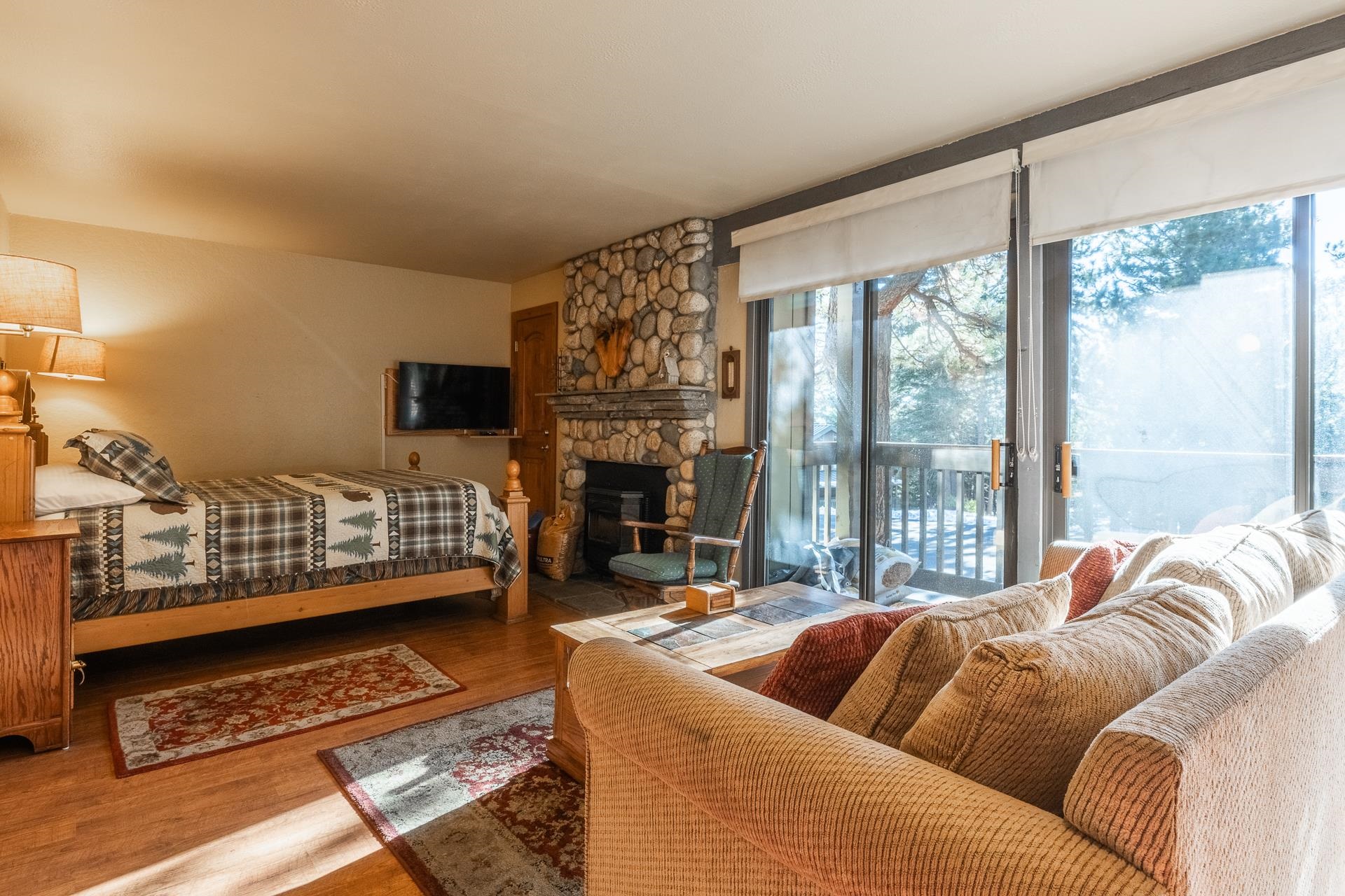 153 Lake Mary Road, Unit 29 Mammoth Lakes, CA 93546 - Photo 2 of 44 a living room with furniture and a floor to ceiling window