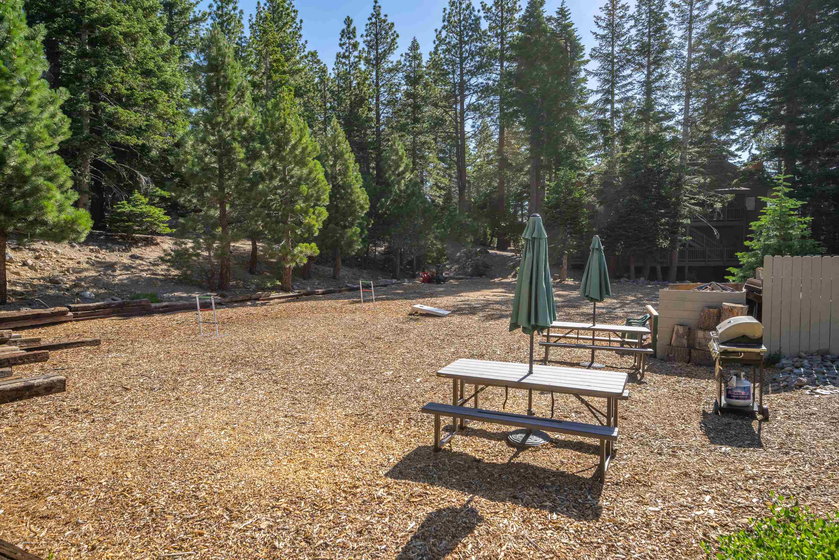 153 Lake Mary Road, Unit 29 Mammoth Lakes, CA 93546 - Photo 39 of 44 a view of a patio with a table and chairs