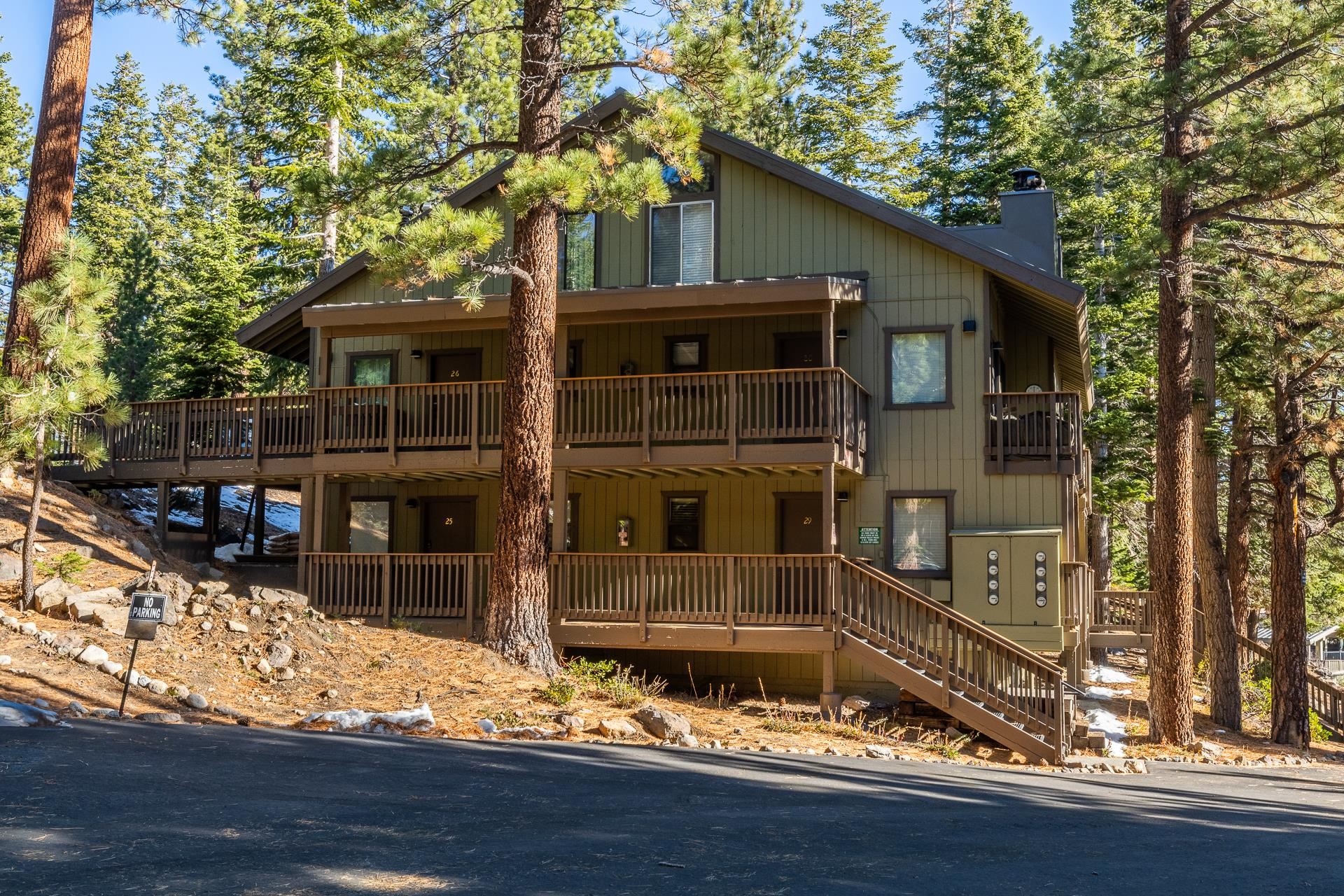 153 Lake Mary Road, Unit 29 Mammoth Lakes, CA 93546 - Photo 42 of 44 a front view of a house with a yard and garage