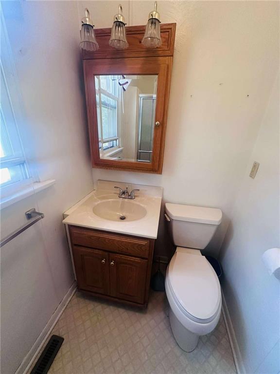 136 Whitestown Road Lyndora, PA 16045 - Photo 14 of 18 a bathroom with a toilet sink and mirror