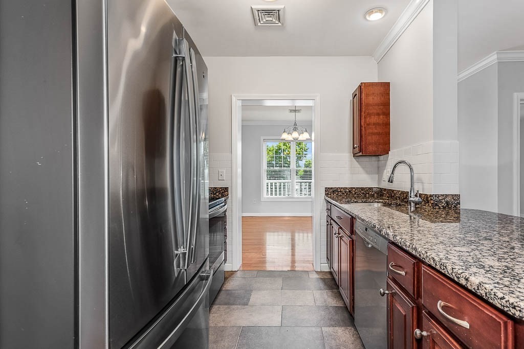 446 Belgrade Avenue, Unit 208 Boston, MA 02132 - Photo 19 of 36 a kitchen with granite countertop a sink and a stove