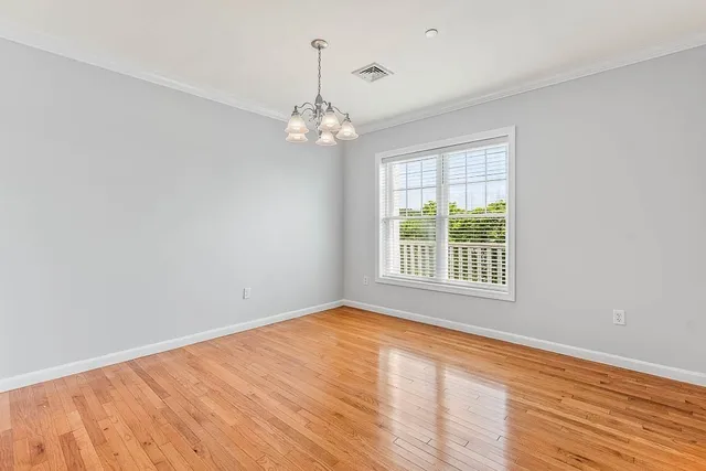 a bathroom with a granite countertop sink toilet a mirror a vanity and shower