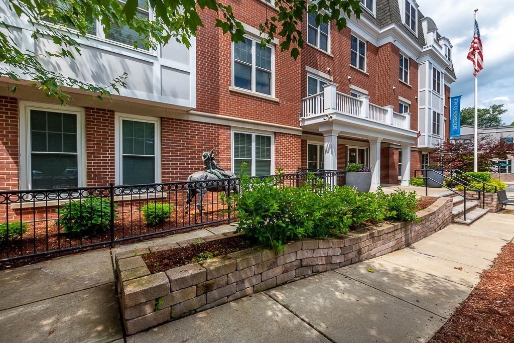 446 Belgrade Avenue, Unit 208 Boston, MA 02132 - Photo 3 of 36 a front view of a multi story residential apartment building with a yard