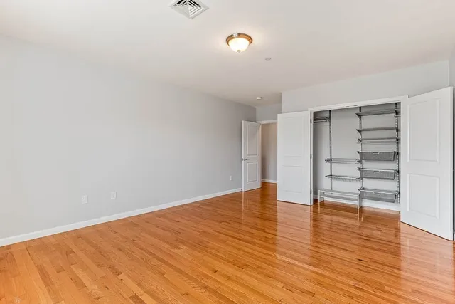 a view of a hallway with washer and dryer