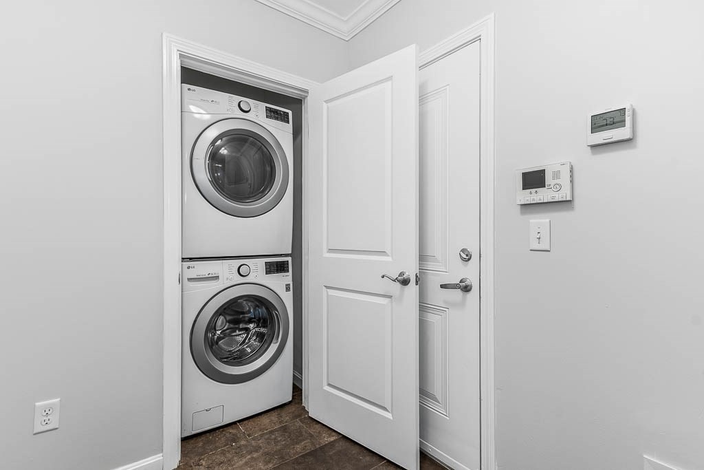 446 Belgrade Avenue, Unit 208 Boston, MA 02132 - Photo 35 of 36 a view of a hallway with washer and dryer