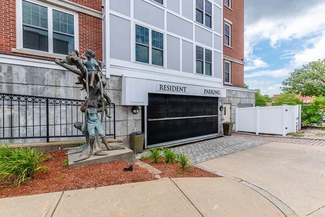 a front view of a house with a yard and a garage