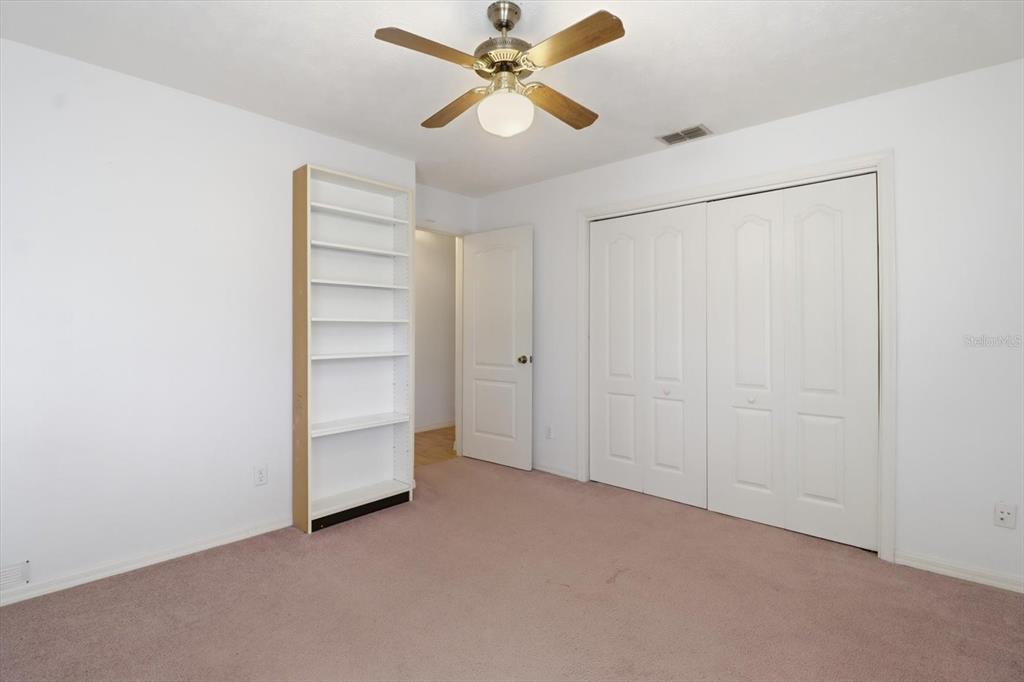 6355 East Rush Street Inverness, FL 34452 - Photo 19 of 27 a view of an empty room with a ceiling fan